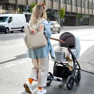 Sac à langer convertible en sac à dos beige
