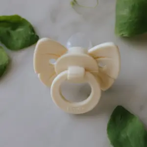 Sucette orthodontique en silicone Binky Bow Oat White (0 mois et +)