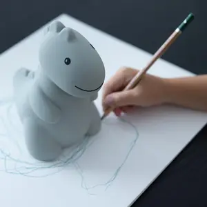 Tirelire Jéroom le dinosaure sauge (15 cm)